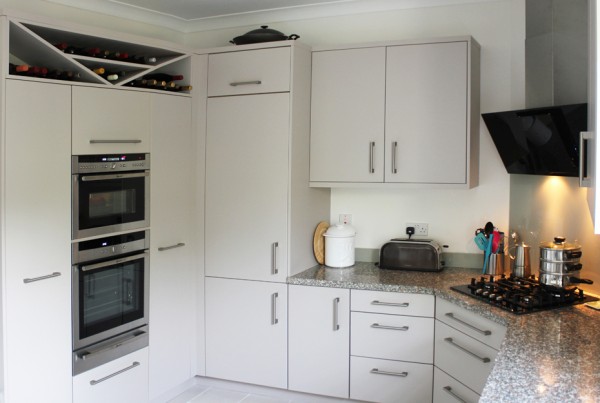 White kitchen with granite worktops and two ovens