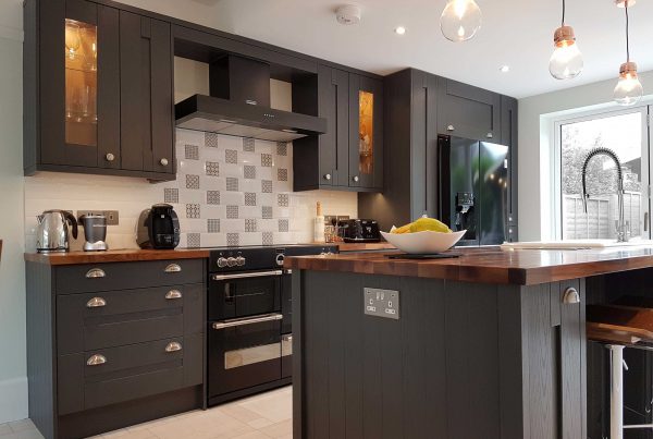 Graphite kitchen with dark wood cupboards